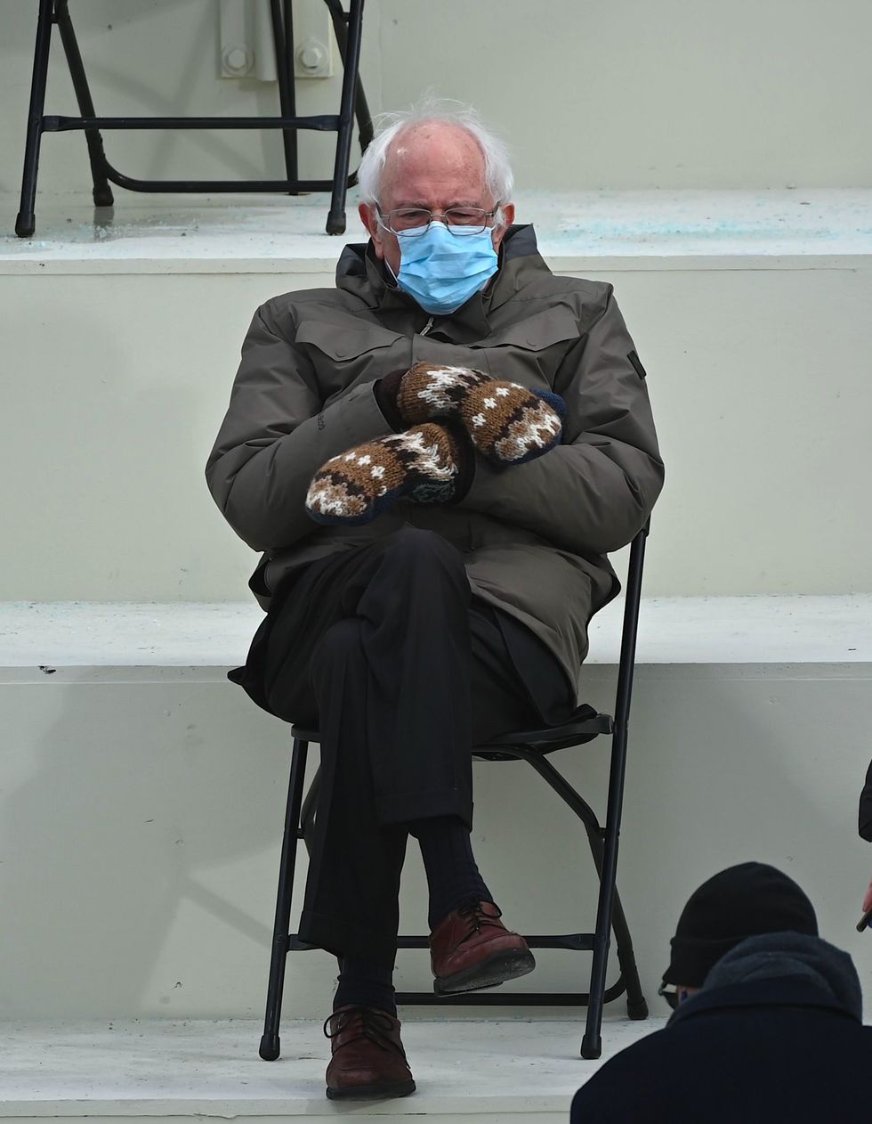 Bernie Sanders sits looking depressed at Biden's inauguration